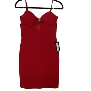 BEBE mini dress with rhinestone accent and peep hole​